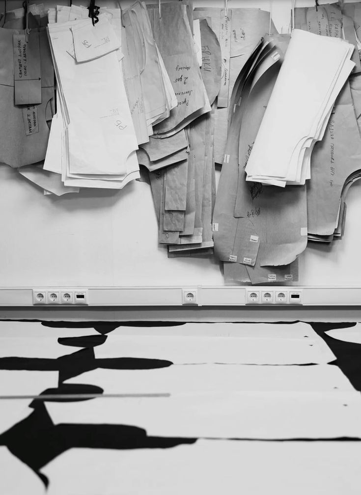 Paper garment patterns above a cutting table